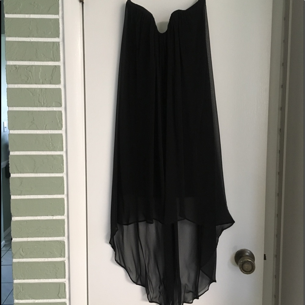 Black chiffon short dress long at the back .